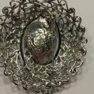 Broche turquoise zilverkleurig strass