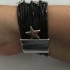 Armband zwart met magneetsluiting en sterretjes