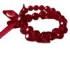 Armband op elastiek met rode facetkralen