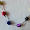 Ketting met aluminium cilinders en zilverkleurige buisjes
