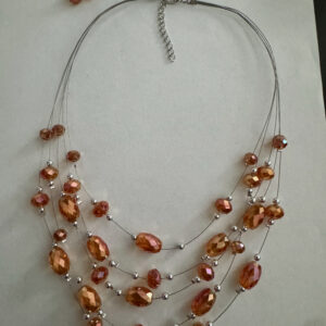 Mooie oranje/goudbruin handgemaakte laagjesketting met bijpassende oorbellen