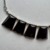 Zilverkleurige ketting met rechthoek hangers