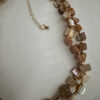 Beige schelpketting met goudkleurige kraaltjes