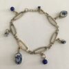 Schakelarmband zwaar verzilverd met delftsblauwe tulpkraaltjes